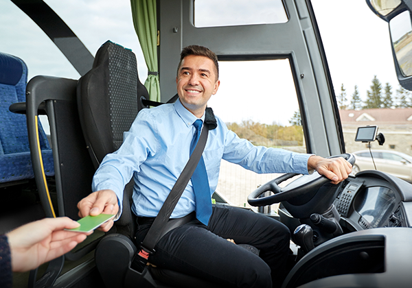 Bus driver accepting passenger ticket