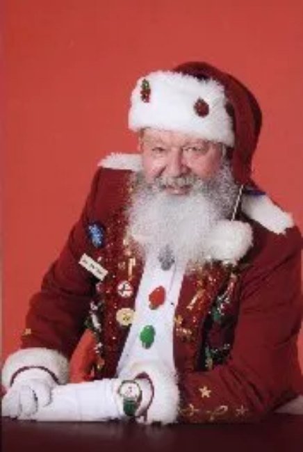 Smiling person in Santa outfit