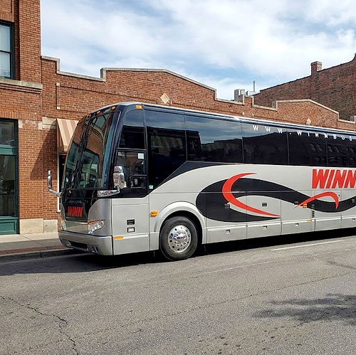 Charter bus parked on street